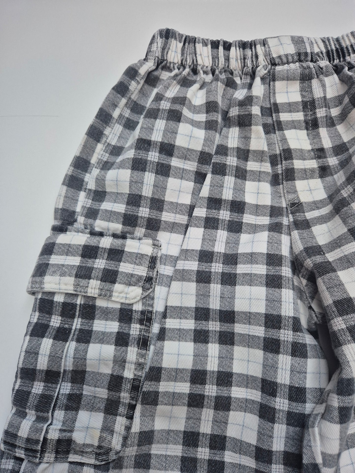 Zwart-wit geruite broek met zak – maat 104 | 3 -4 jaar